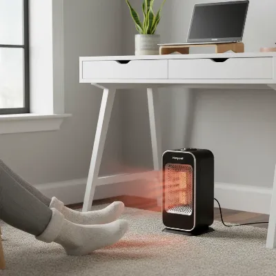 Honeywell 360 Degree Surround Space Heater warming a modern home office with soft light